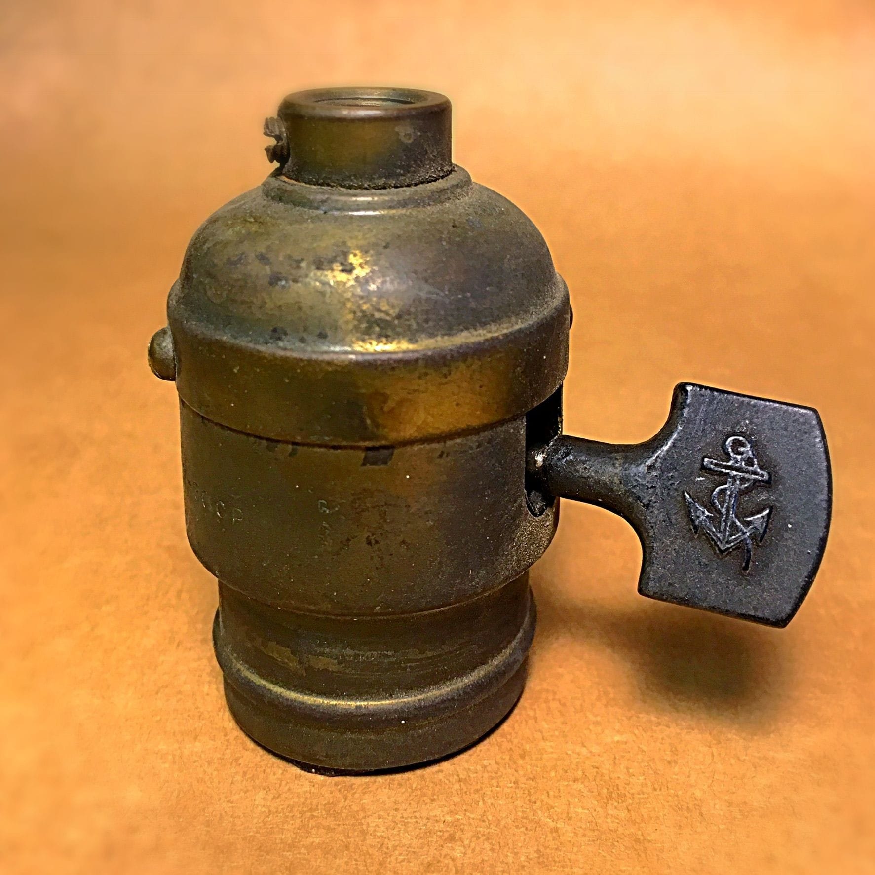 Early electric lamp socket with anchor logo on paddle