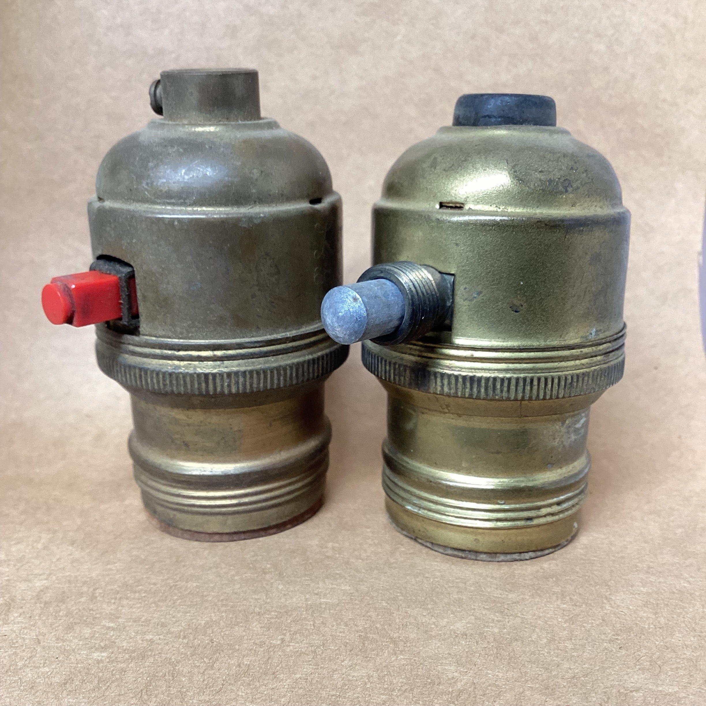 A pair of Levolier's push button lamp sockets from mit twentieth century. The Lamp Repair Shop, South Portland, Maine.